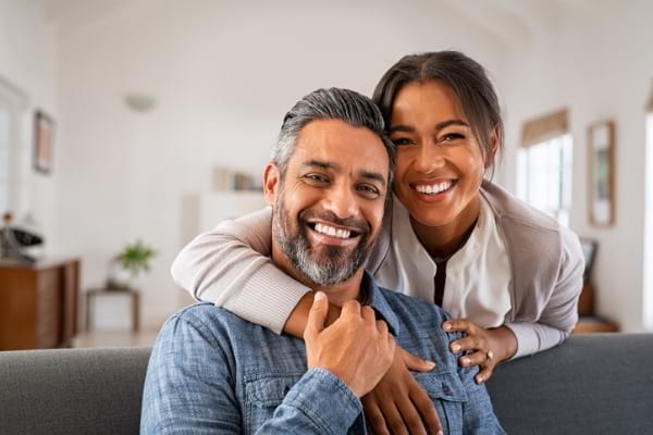 Couple hugging on the couch 